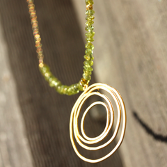 Tequila Sunrise Necklace - 18k Gold Swirl Charm, Green Peridot & 18k Gold Nuggets Necklace.